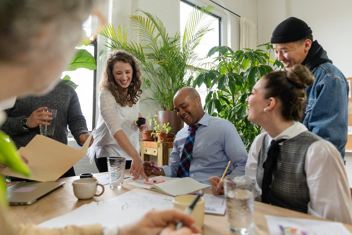 Free Happy Workers in a Meeting Stock Photo