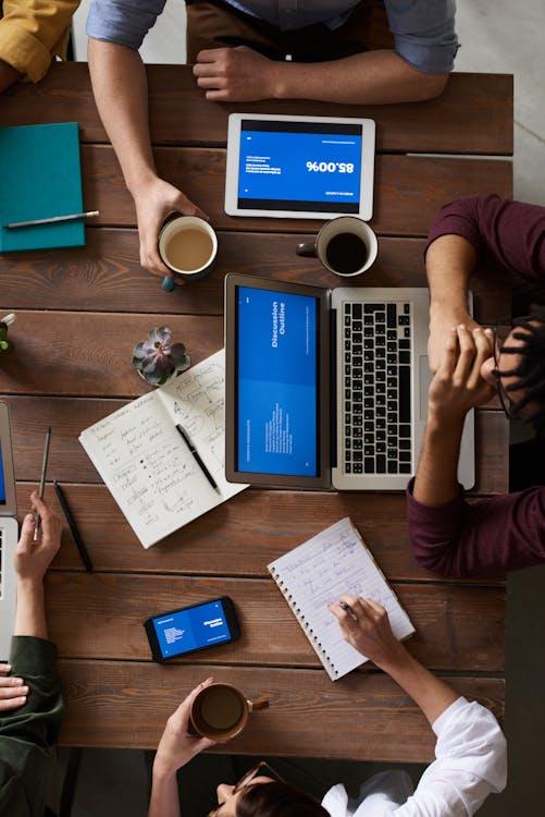 Free Top View Photo of People Having a Meeting Stock Photo