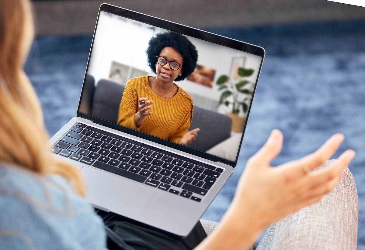 Substance abuse EMR software: employee using her laptop for a video call