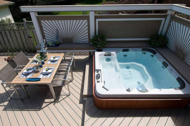 things to consider while designing your deck hot tub with dining area custom built michigan