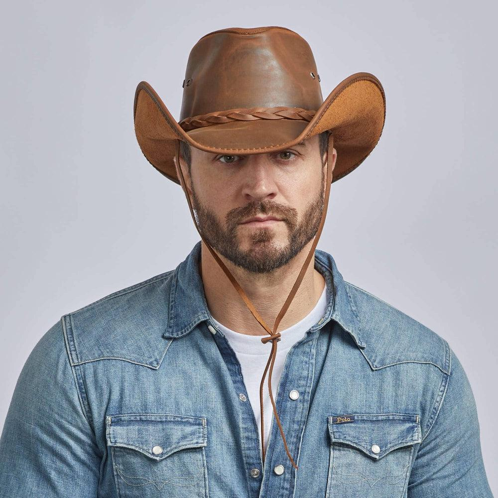 Picture of a man looking good with his cowboy outfit