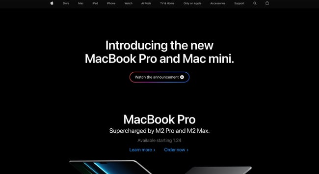 Thách thức thiết kế web: Hình ảnh hiển thị trang chủ của Apple có nội dung "Giới thiệu MacBook Pro và Mac mini mới" và bên dưới là một nút đầy màu sắc có nội dung "Xem thông báo" 