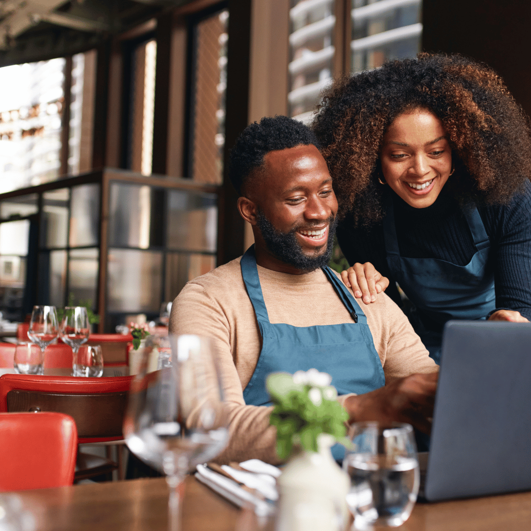 Business owner looking at laptop