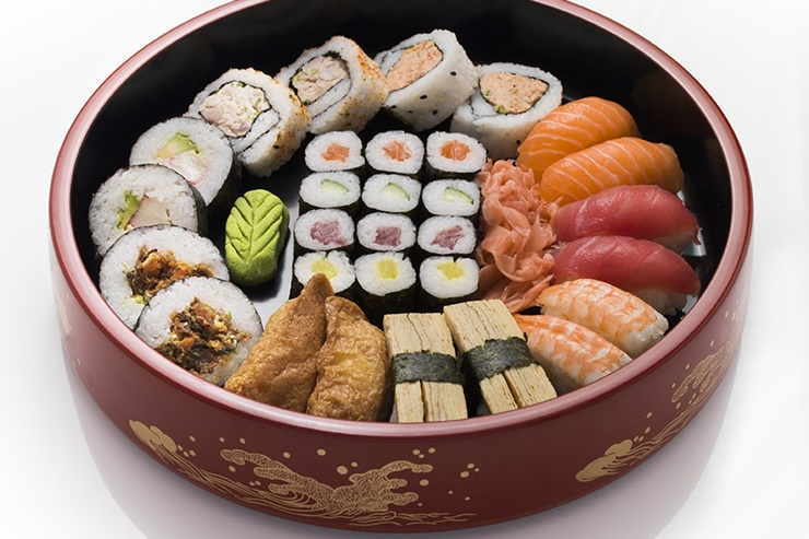 A bowl of sushi

Description automatically generated