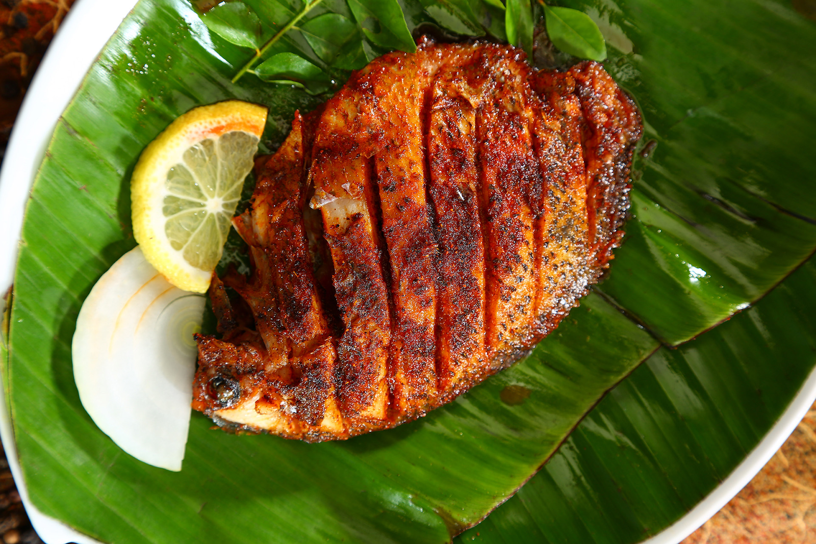 Enjoy delectable bites of fish curry in a claypot.