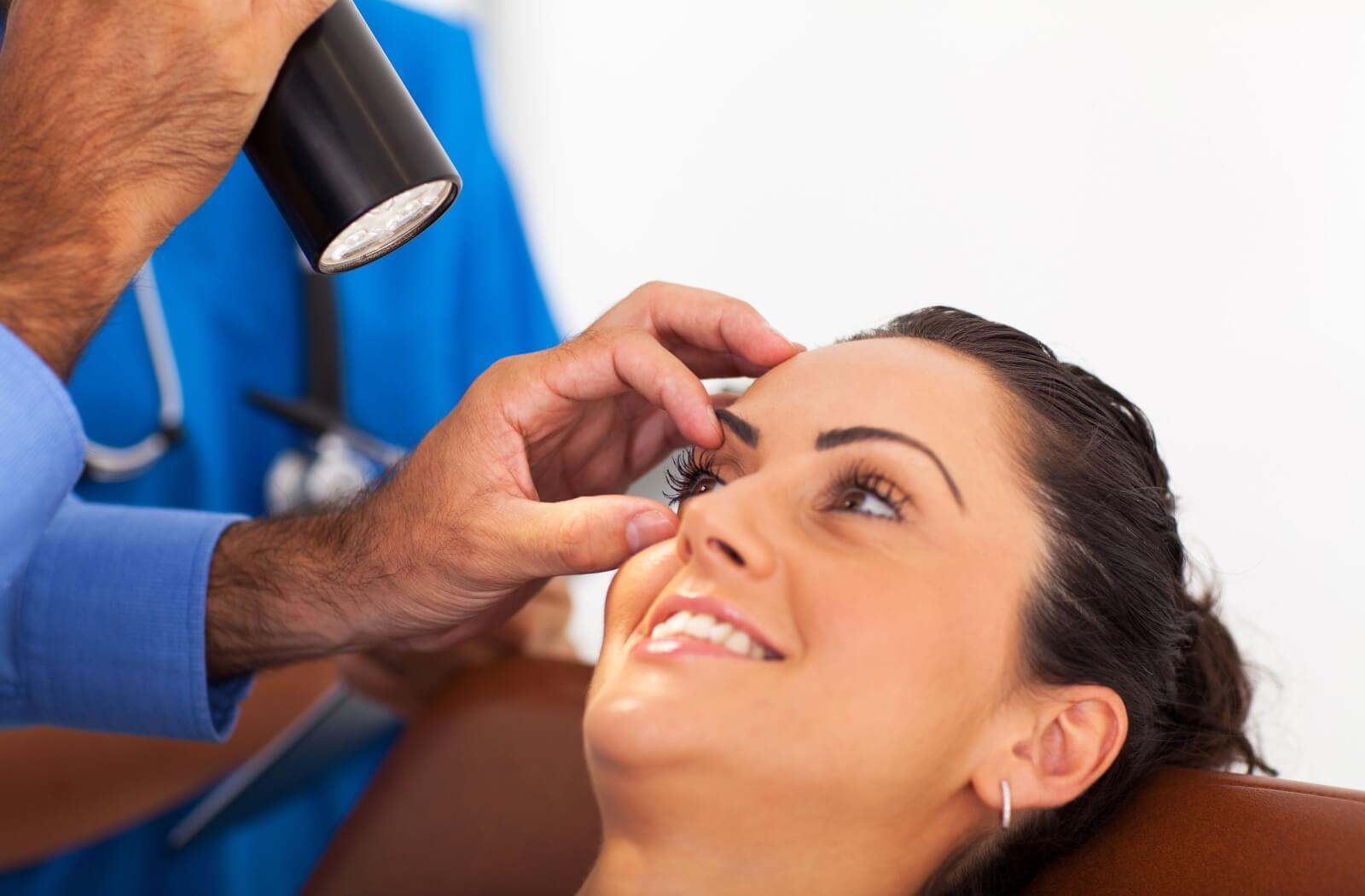 A doctor assessing the health of their patient's eye.