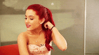 Gif of Ariana Grande flaunting her red hair