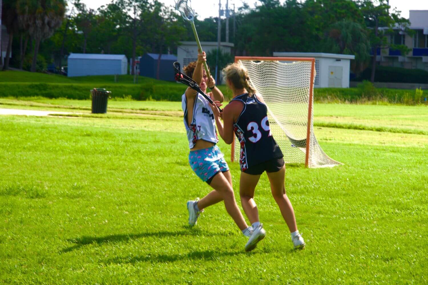 Youth lacrosse athletes during a match at overnight sports camp