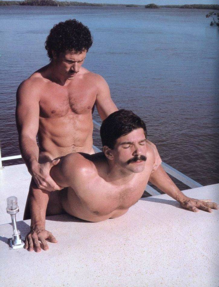 Rod Mitchell getting fucked doggy style by gay muscle male on a boat outside