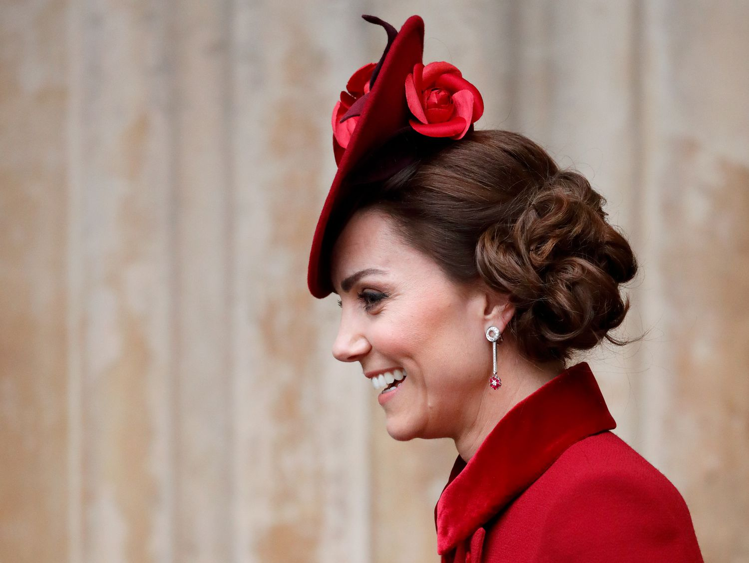 Picture Kate Middleton matching her red fascinator hat with a red coat