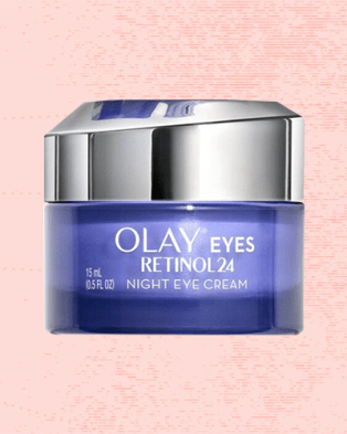Olay Regenerist Retinol24 Night Eye Cream against a pale red background.