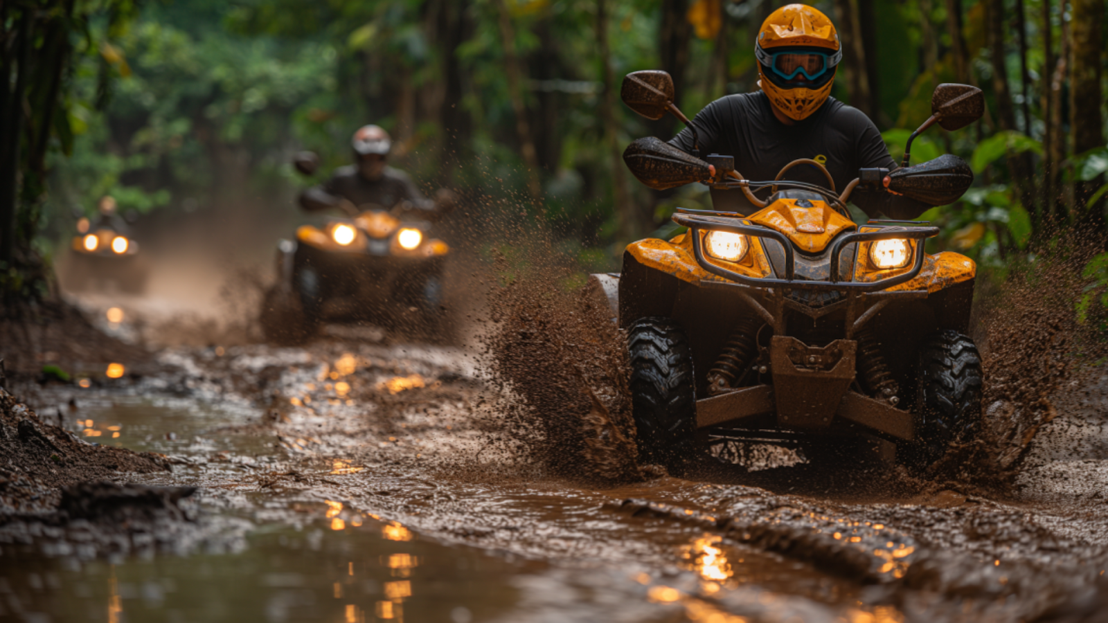 Tourists enjoying a thrilling ATV ride through muddy jungle paths near Playa del Carmen.