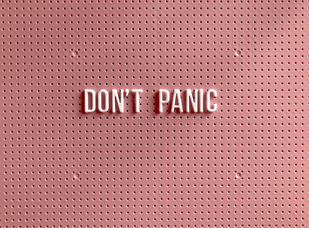 don't panic text on pink polka dot background