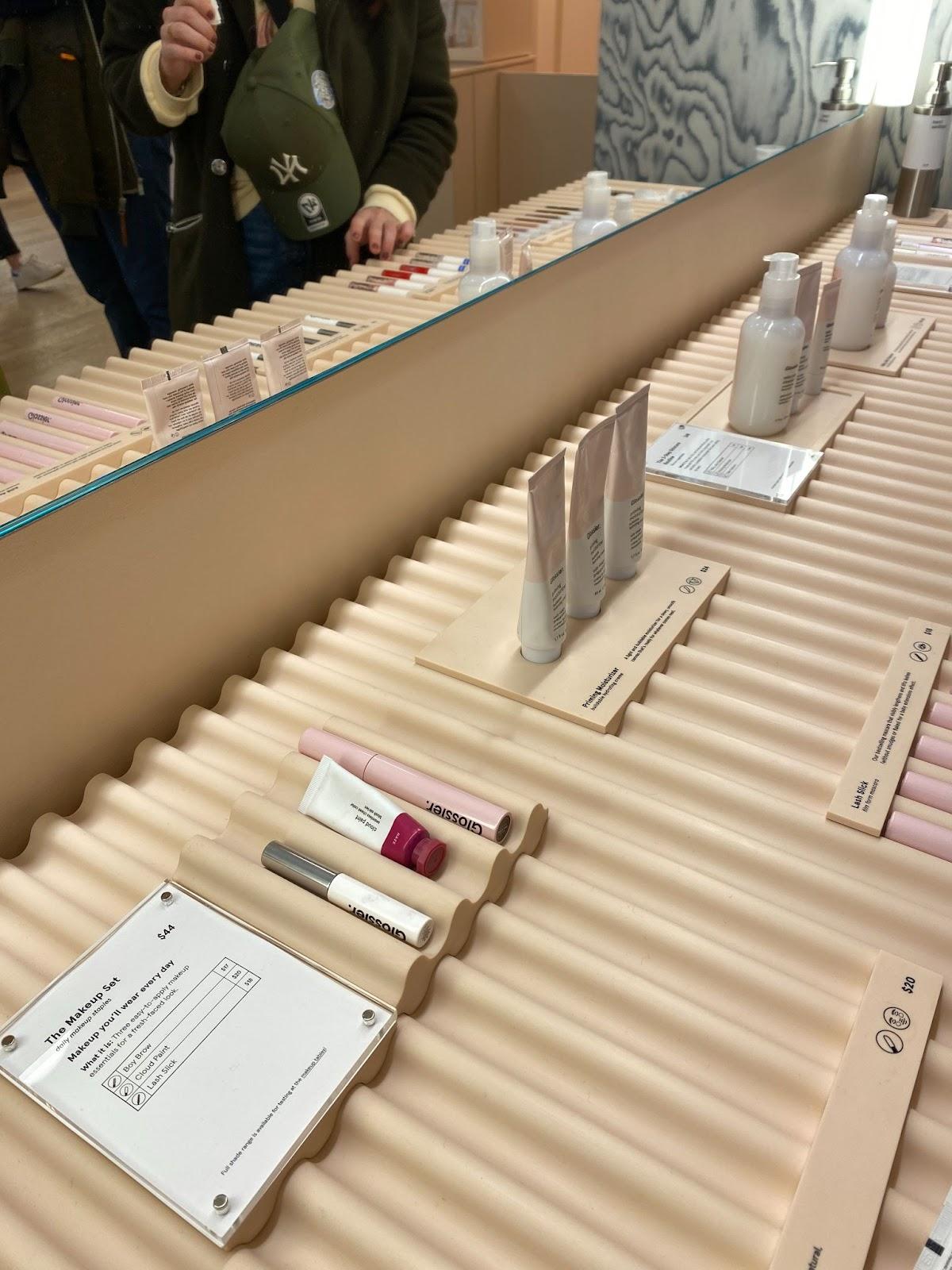 Image of Glossier's Makeup Set bundle on display in its retail store.