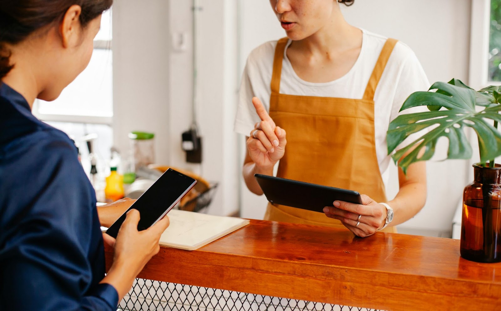 a woman paying another woman online in her business