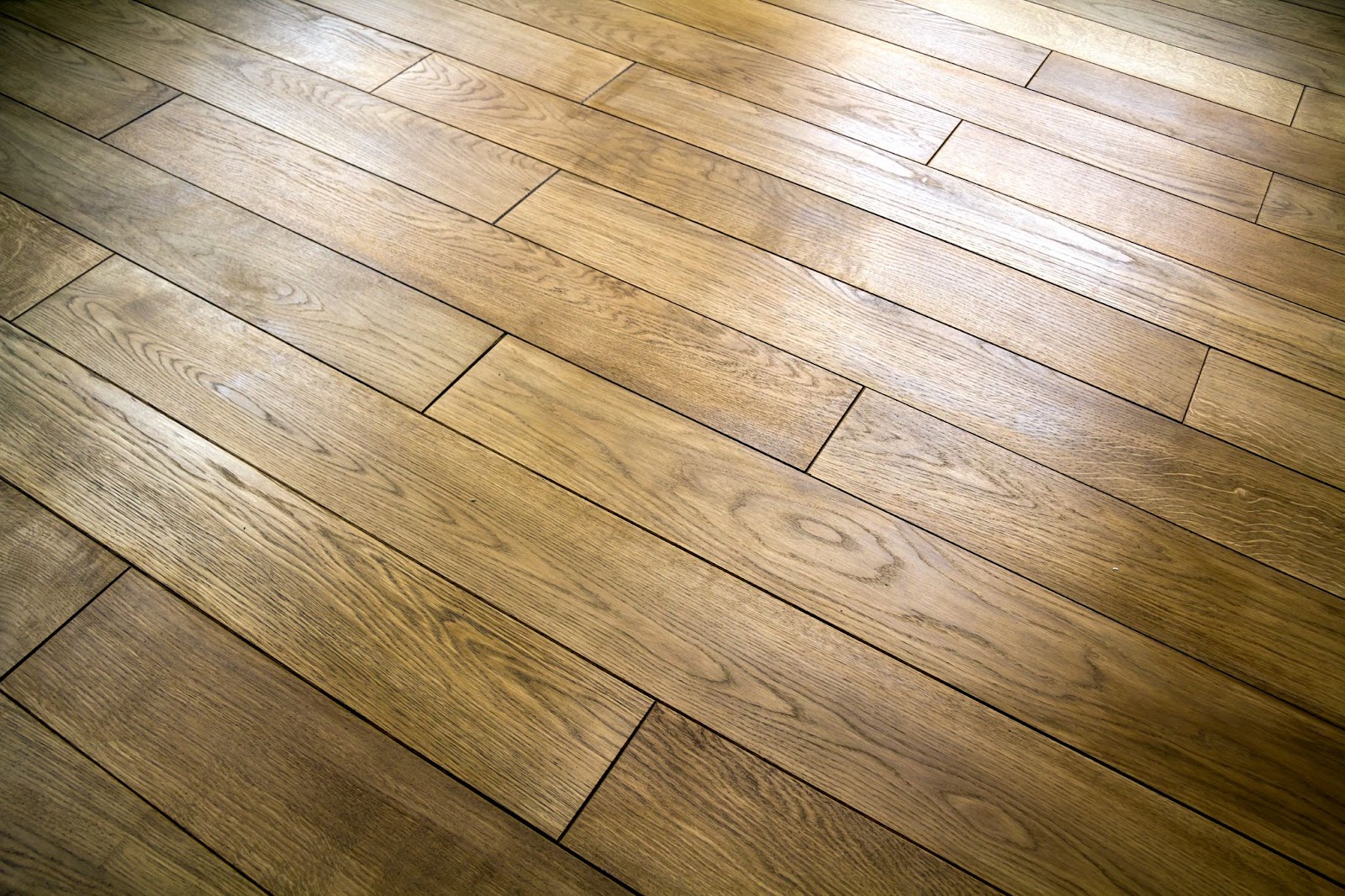 The natural brown texture of the wooden parquet floorboards adds warmth and character to any living space.