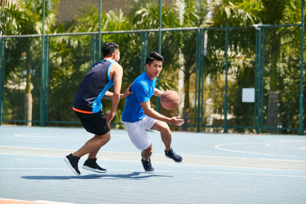 asian-young-adult-playing-oneonone-basketball-picture-id995701724?k=20&m=995701724&s=612x612&w=0&h=YuuINclV75FBYOHoPYjL8UiaaEiuf7FP4f9d92r2AB8=