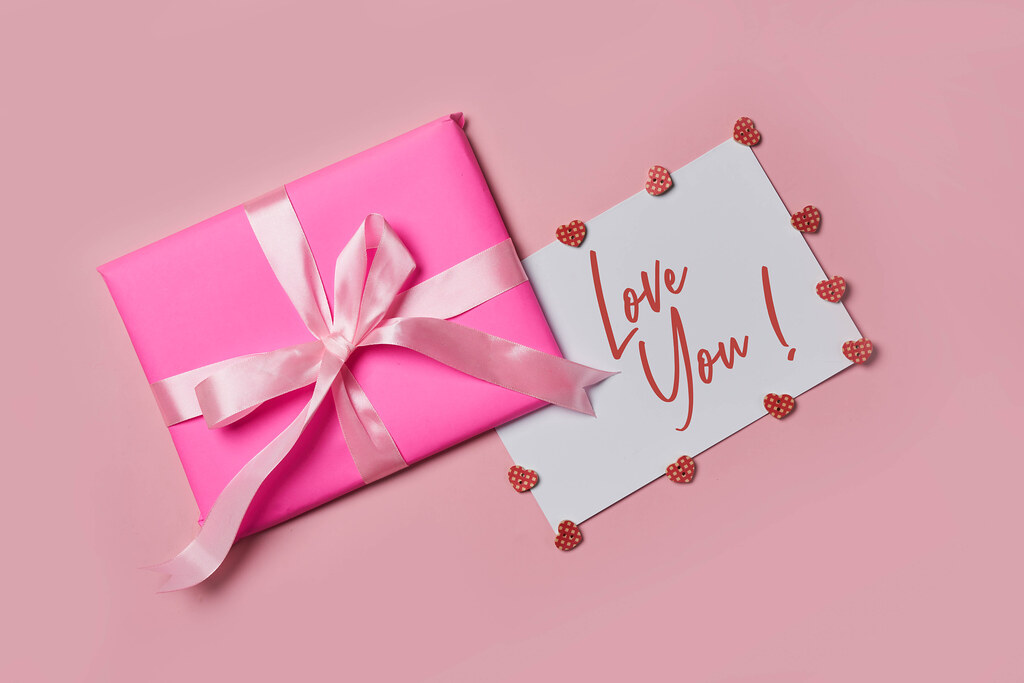 An experience gift wrapped in an envelope with a Love You message. 