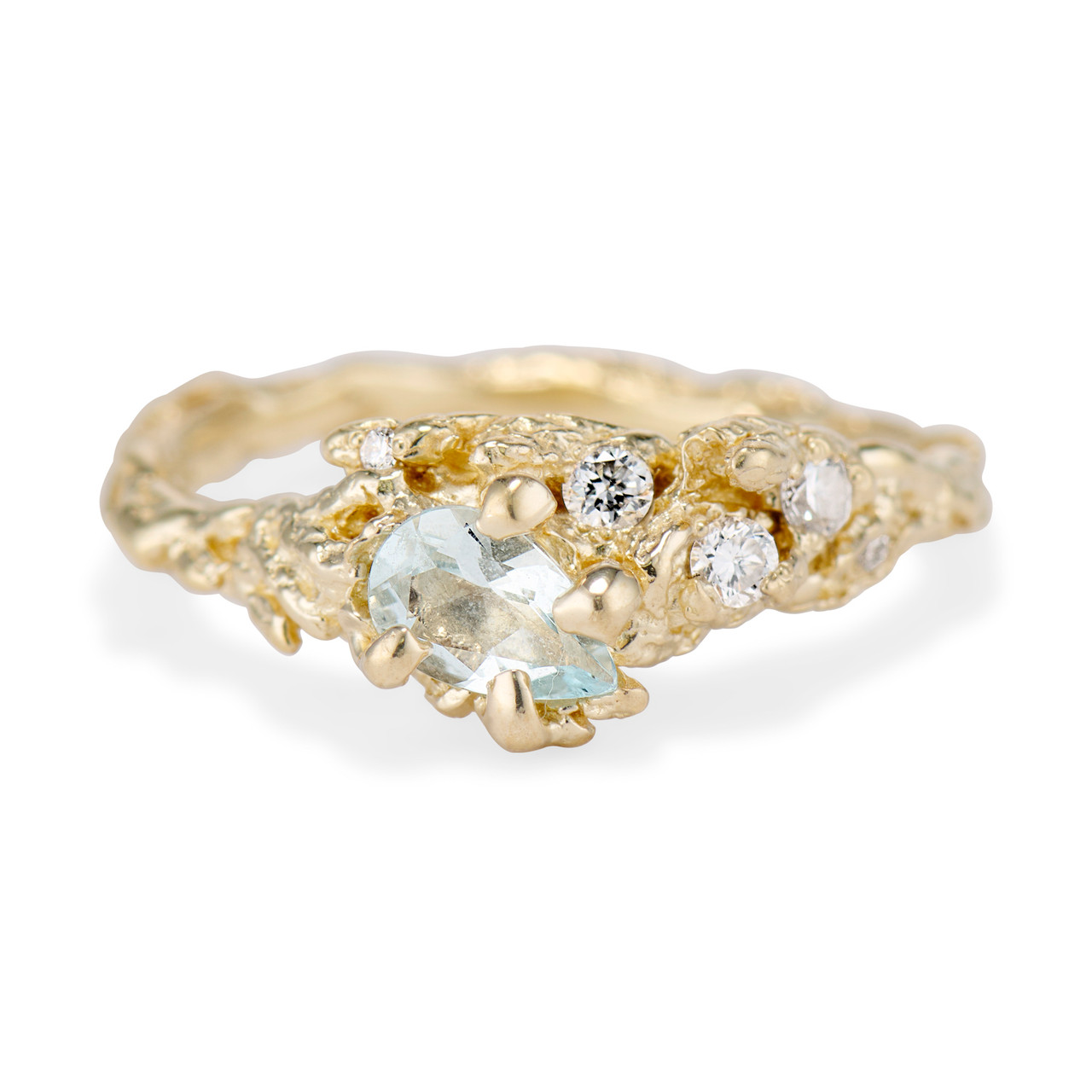 The Juniper Aquamarine and Diamond Cluster Ring. A pear aquamarine is held in place by four prongs while diamonds add shine to the band.