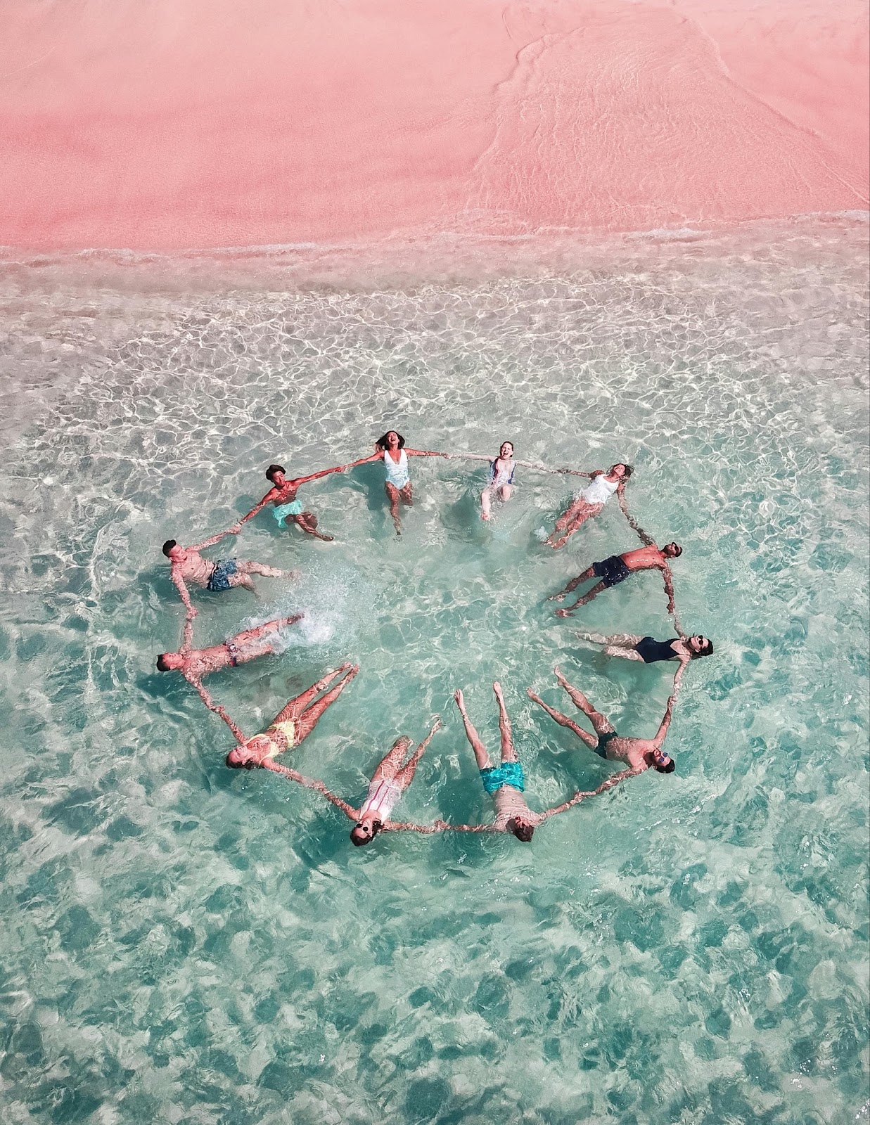 Wedding guests enjoying the cool clear ocean waters and hotel amenities. 