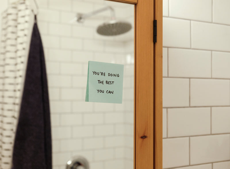 blue note on a bathroom mirror reads a positive message - Image of Gemstones, An image of a person w