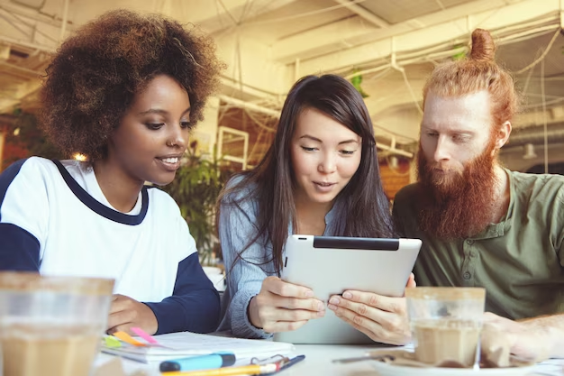 A Team Discussing Something on a Tablet