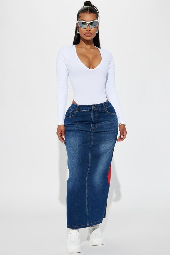 Full picture showing a lady rocking a white bodysuits with  jean