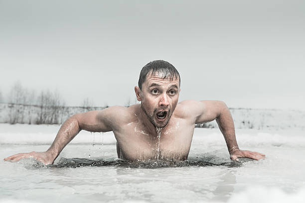 Ice hole swimming Man swimming in the ice hole