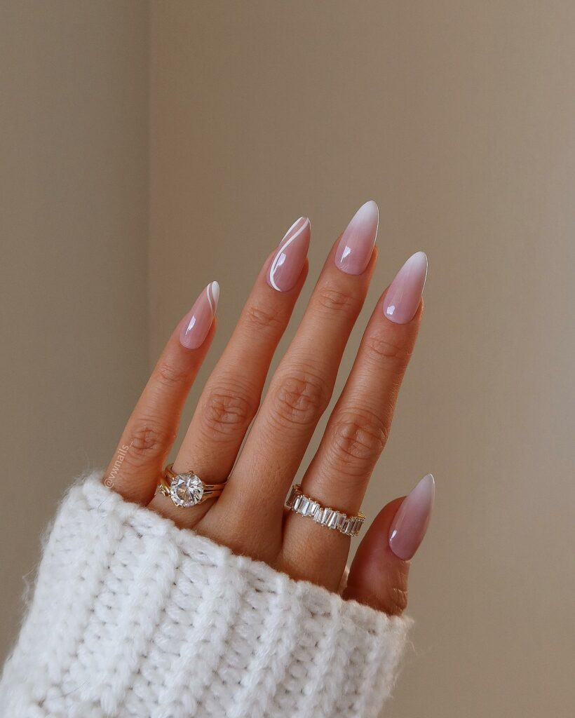 Picture showing beautiful solar nails accessorized with rings 