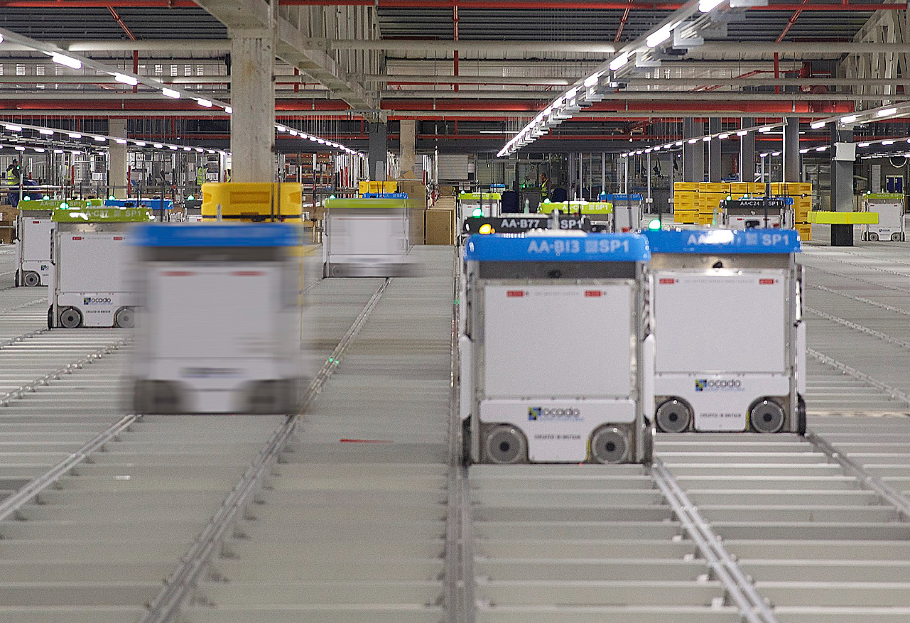 A warehouse with several carts

Description automatically generated with medium confidence