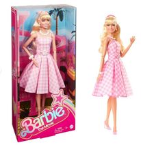 May be an image of 2 people, toy and text that says 'Barbie Barbie TheMovie Movie The 1'