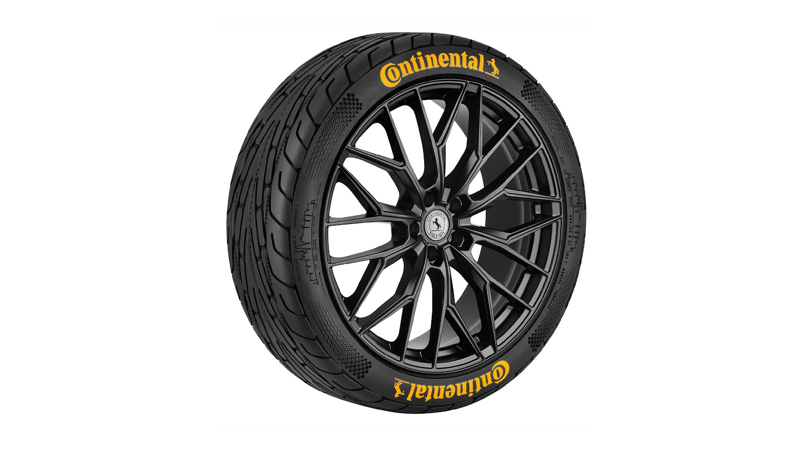 A black tire with yellow text on it

Description automatically generated