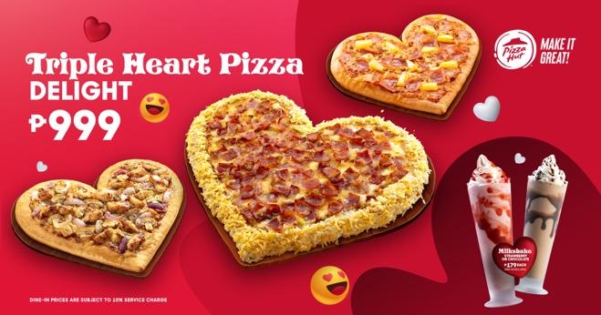 A heart shaped pizzas on a red background

Description automatically generated