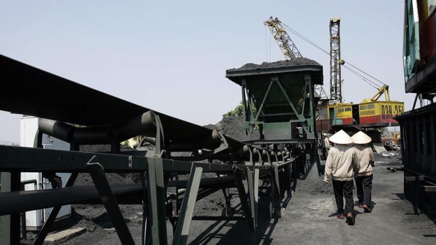 Workers are seen in Ninh Binh Power Plant, which is a coal fired power plant to supply electricity, in Ninh Binh Province in Vietnam, on Sept. 19, 2007