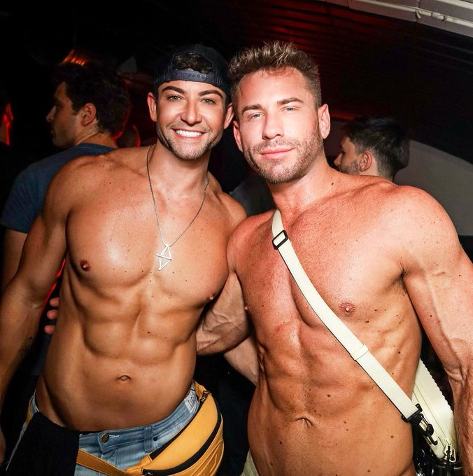Koaty and Sumner Blayne posing for a gay circuit party weekend photo smiling half naked for the camera