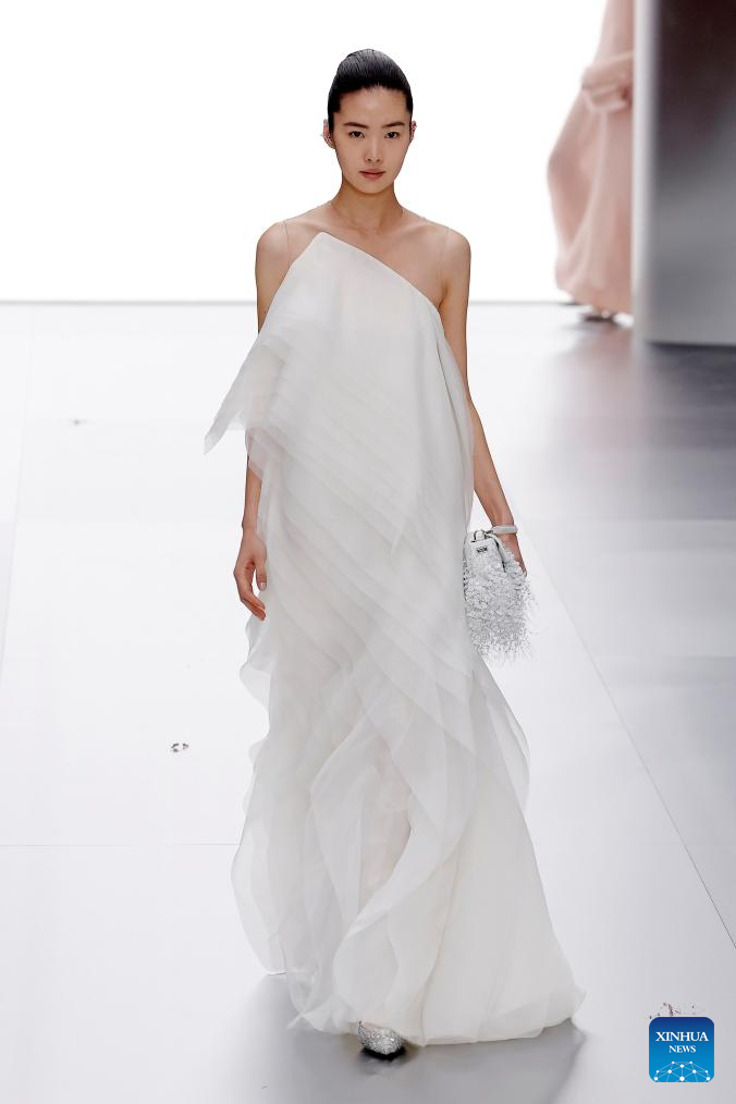 Picture of a model in a gorgeous white gown for the Fendi show