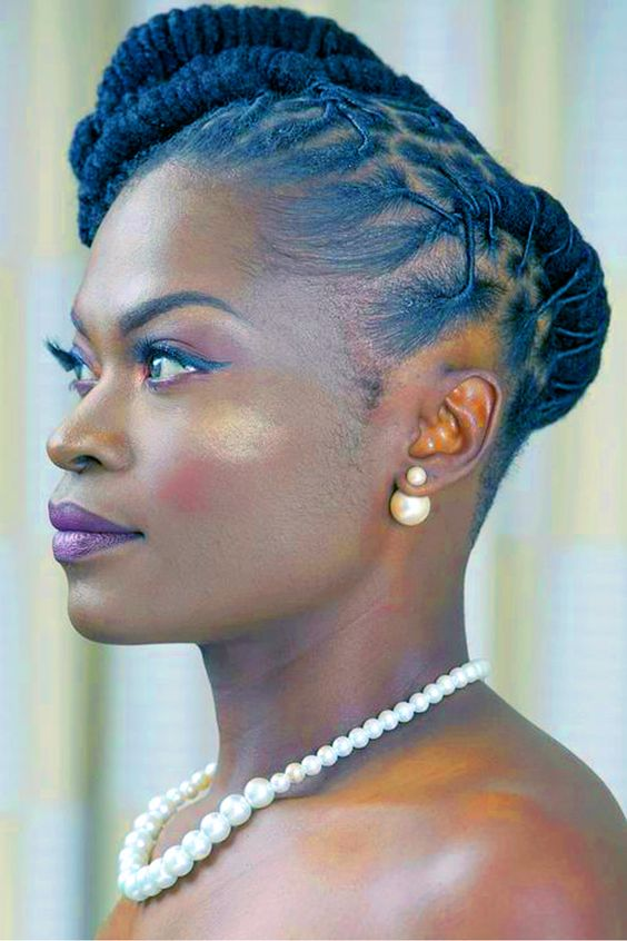 Loc styles for women: Picture of a lady styling a  her gorgeous  dreadlock