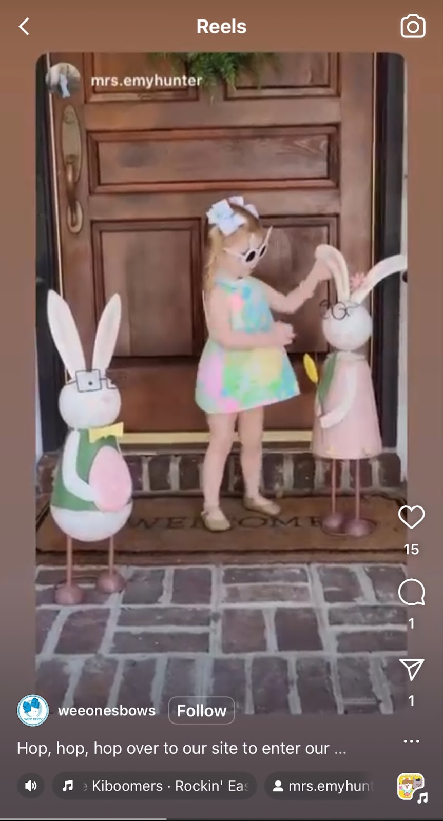 Easter marketing strategy example: Screenshot of Instagram reel featuring little girl playing with two large decorative bunnies on her front porch