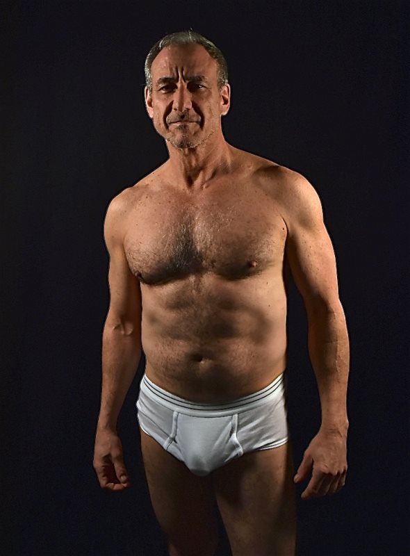 David Pevsner standing shirtless wearing white tighty whitey underwear