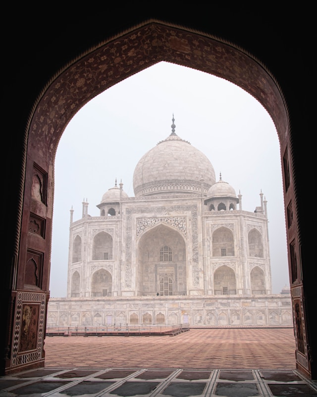 A foggy view from a gate of the taj mahal