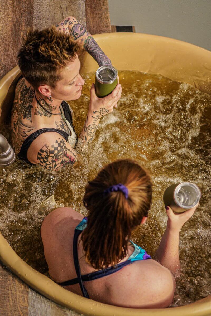 two people taking a beer bath at Oakwell Beer Spa