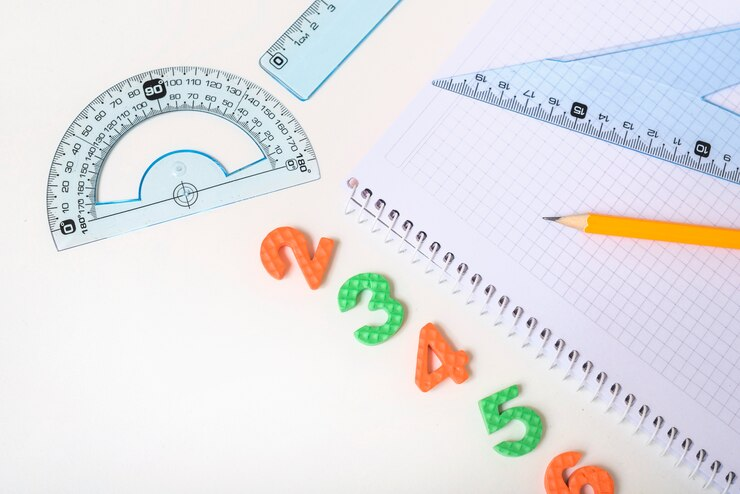 A diverse set of numbers and stationery, symbolising the mathematical journey.