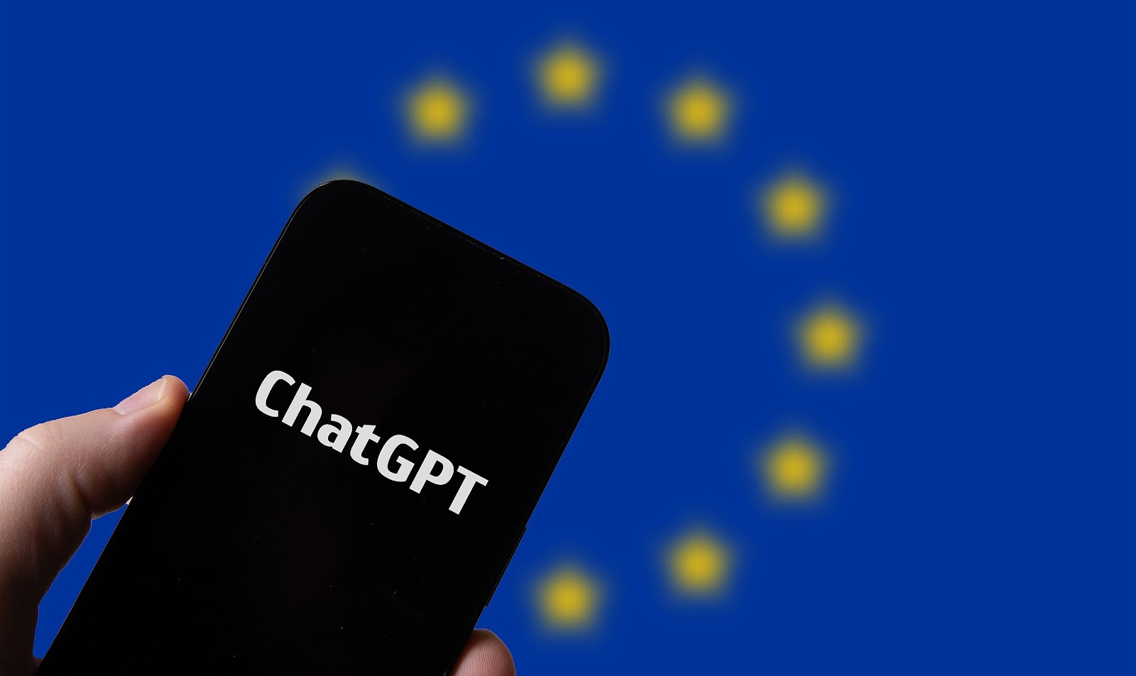 https://upload.wikimedia.org/wikipedia/commons/thumb/a/af/Hand_holding_smartphone_with_OpenAI_Chat_GPT_against_flag_of_EU_%2852917311860%29.jpg/2560px-Hand_holding_smartphone_with_OpenAI_Chat_GPT_against_flag_of_EU_%2852917311860%29.jpg