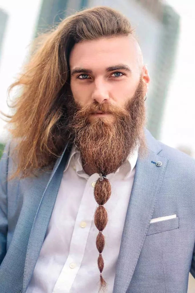 Picture of  a man rocking the undercut with long mane 
