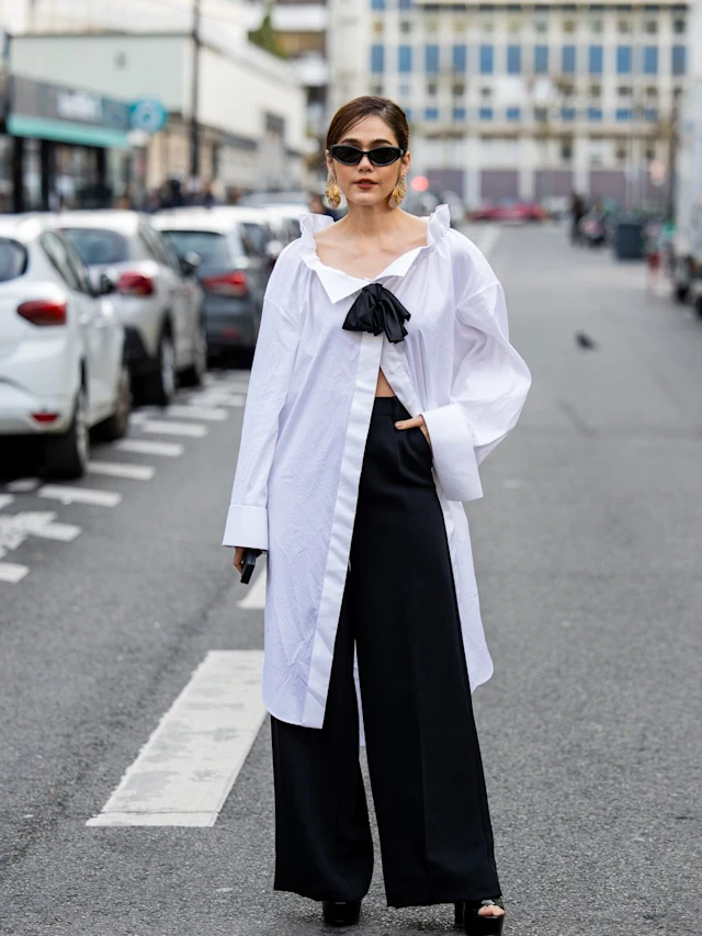 Paris Haute Couture Week 2024: Picture of an attendee in a stylish white top and  trouser for the event