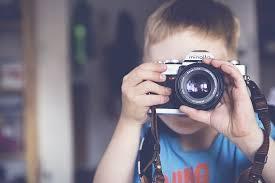 Royalty-Free photo: Tilt shift lens photography of girl holding black Canon  DSLR camera | PickPik