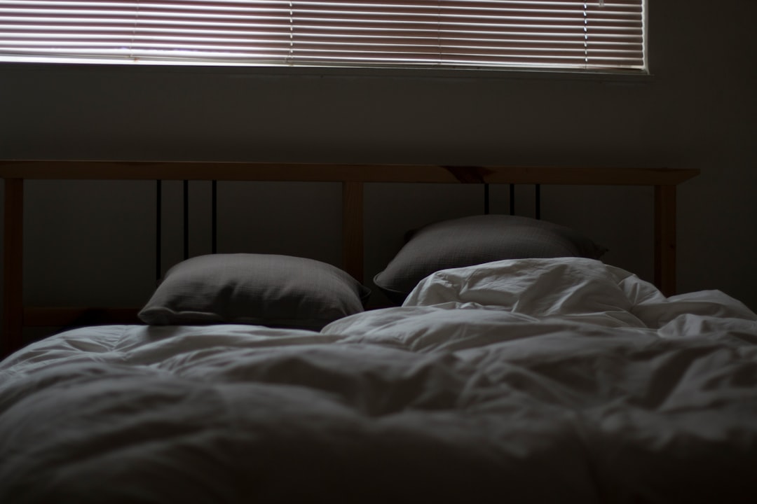 empty white and gray bed set