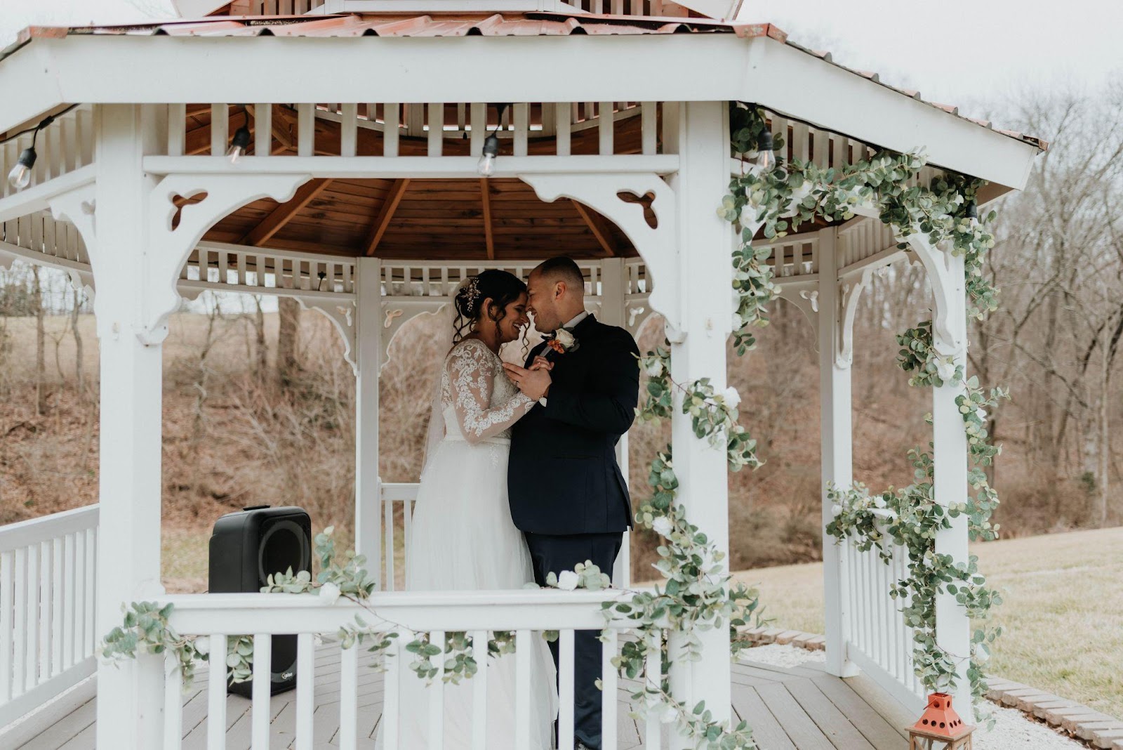 Couple dancing in a gazebo at their outdoor micro wedding