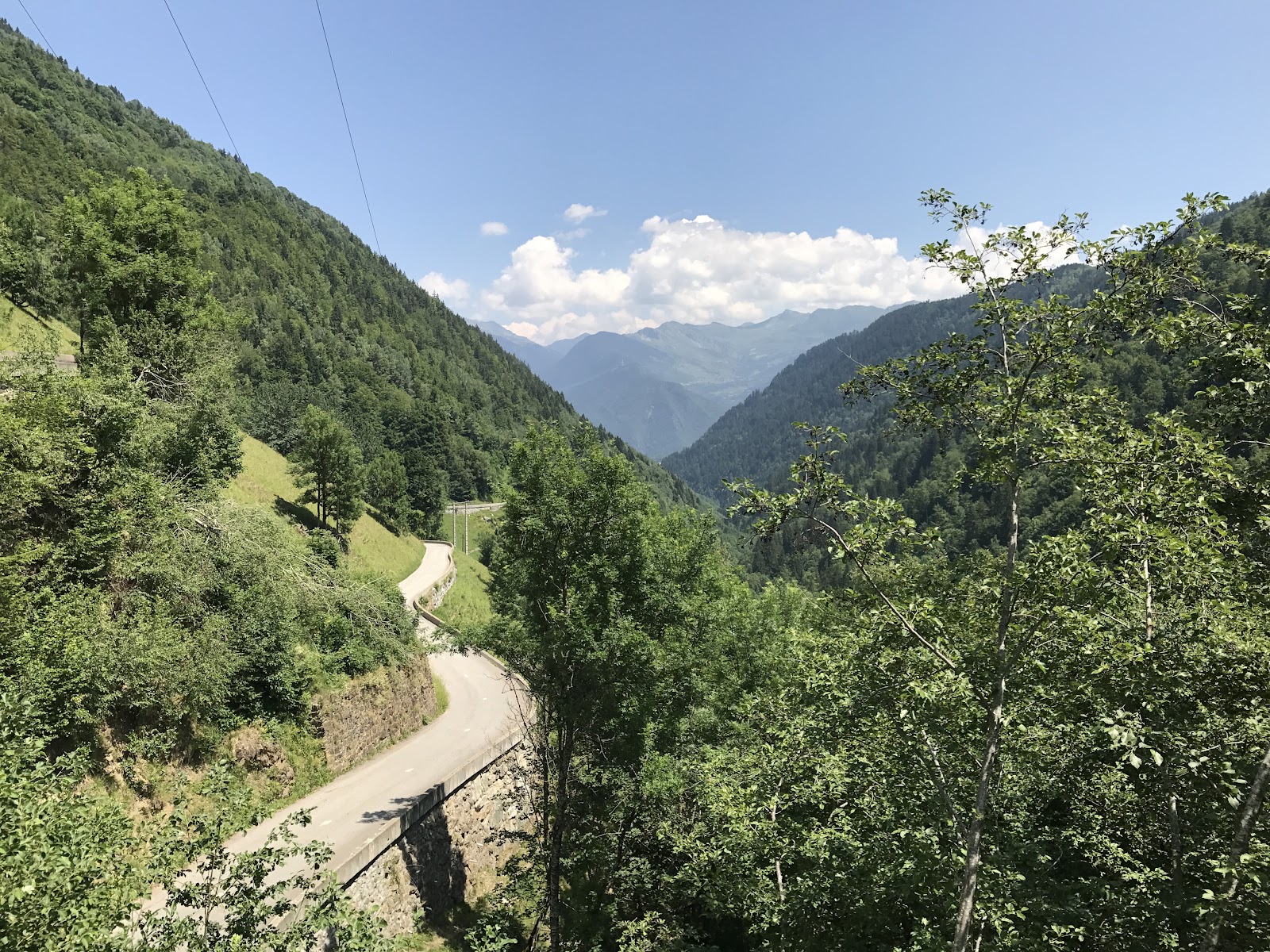 Climbing Col de Madeleine from La Léchère by bike - roadway along canyon