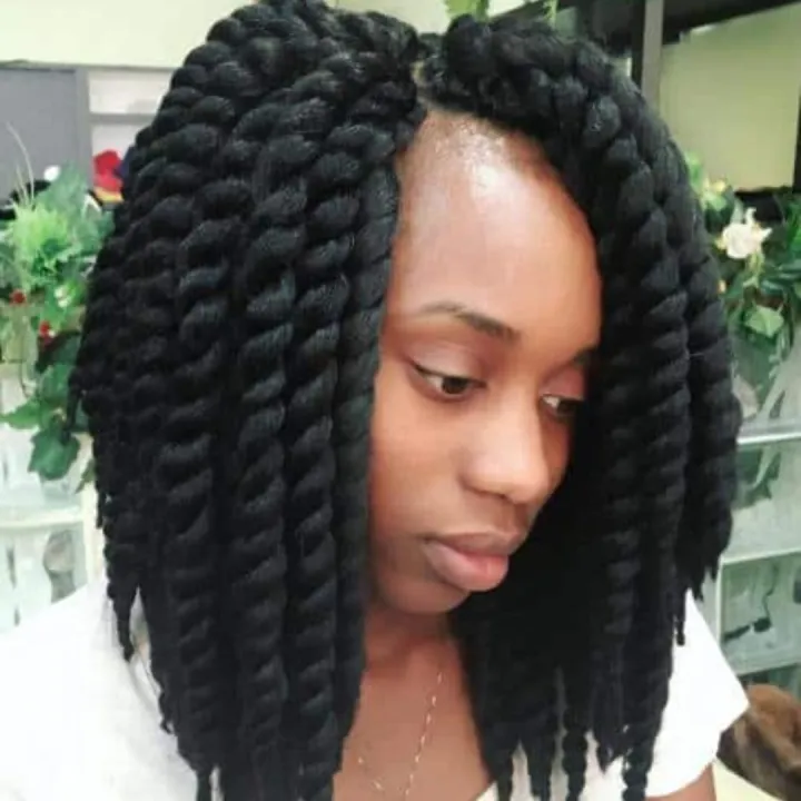 Close up view of a lady rocking the jumbo sized hairstyle